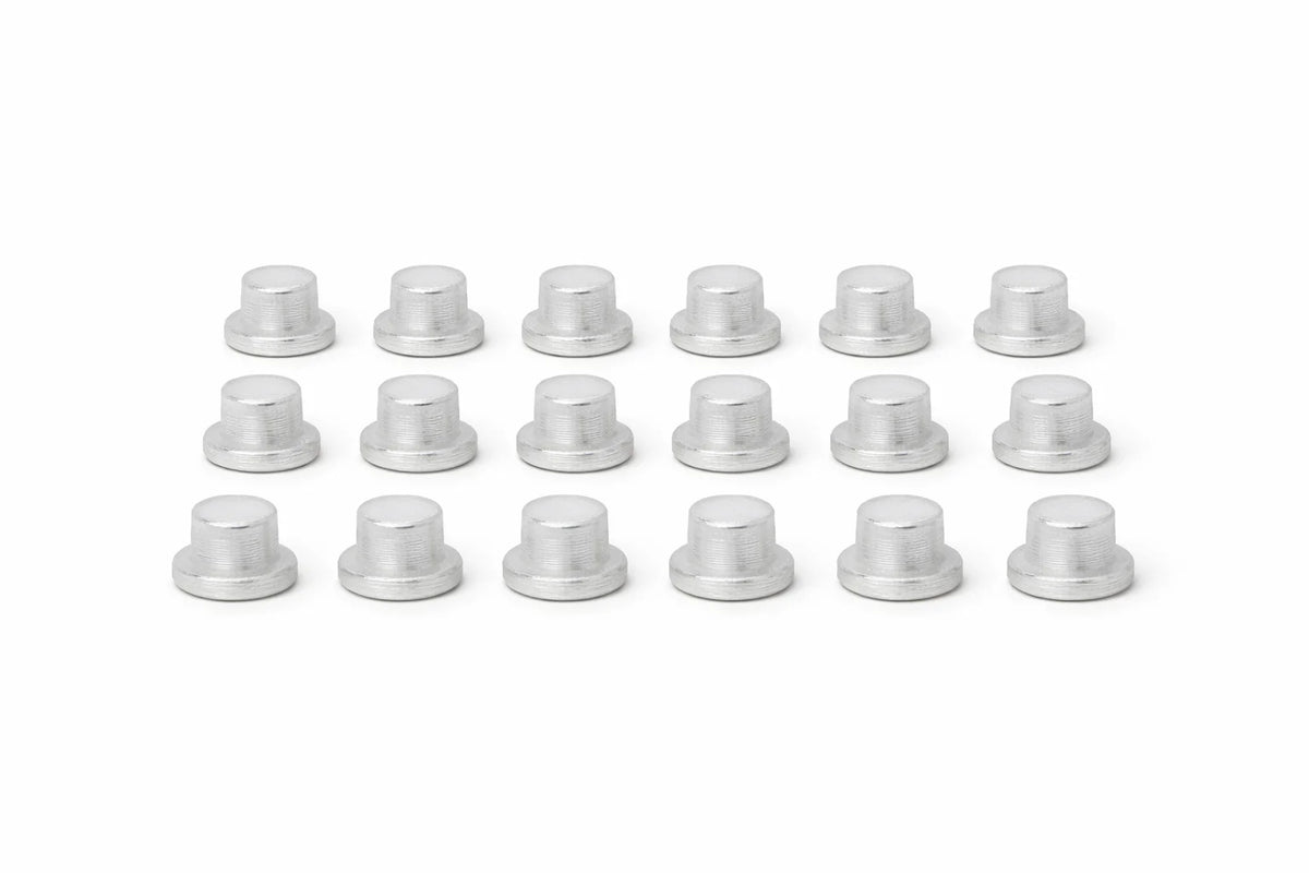 Plastic Stopper set: rows of white 10 mm plastic stoppers with ribbed caps on a white background