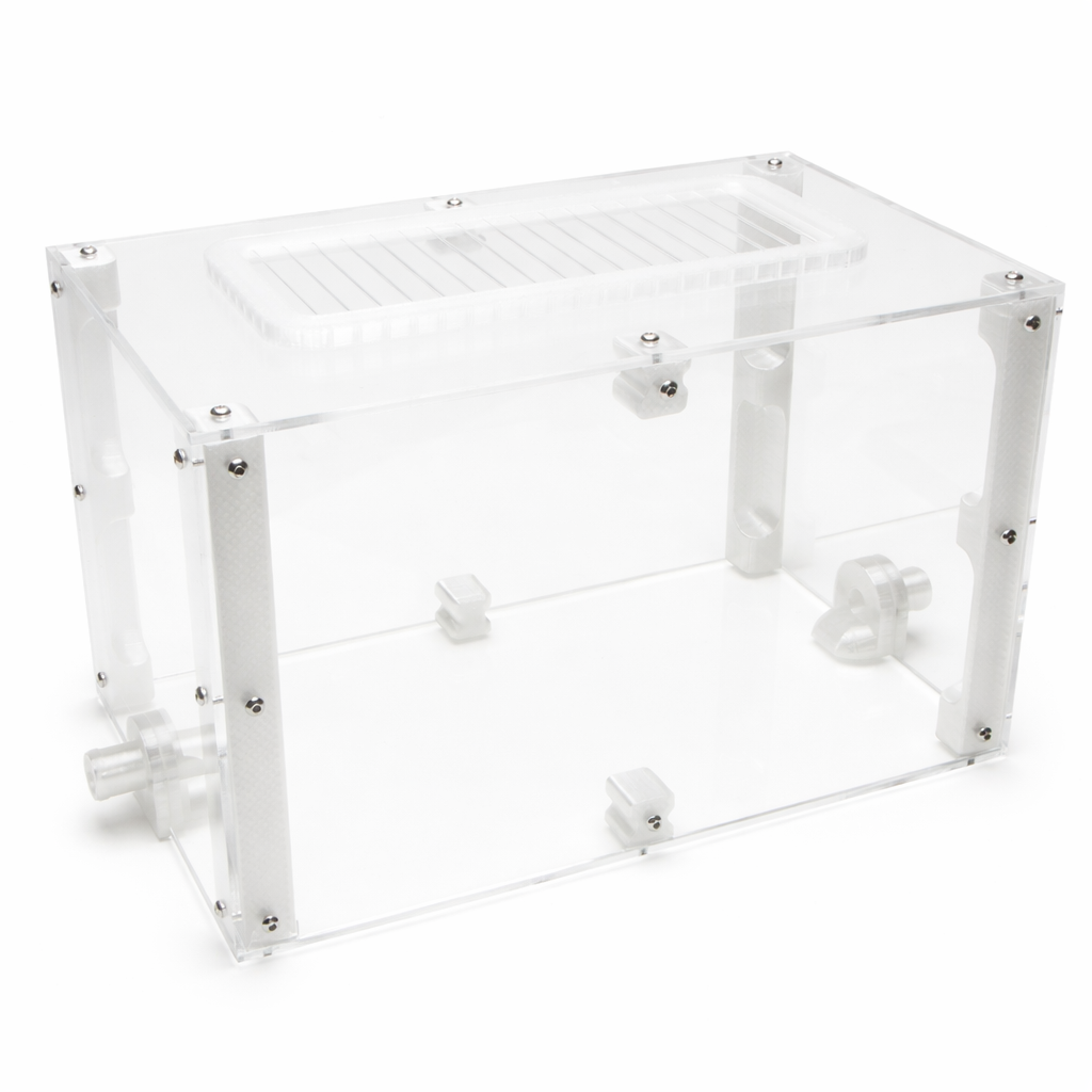 Large Outworld acrylic feeding arena at an angle, showing the mesh vent lid, mounting posts, and side port