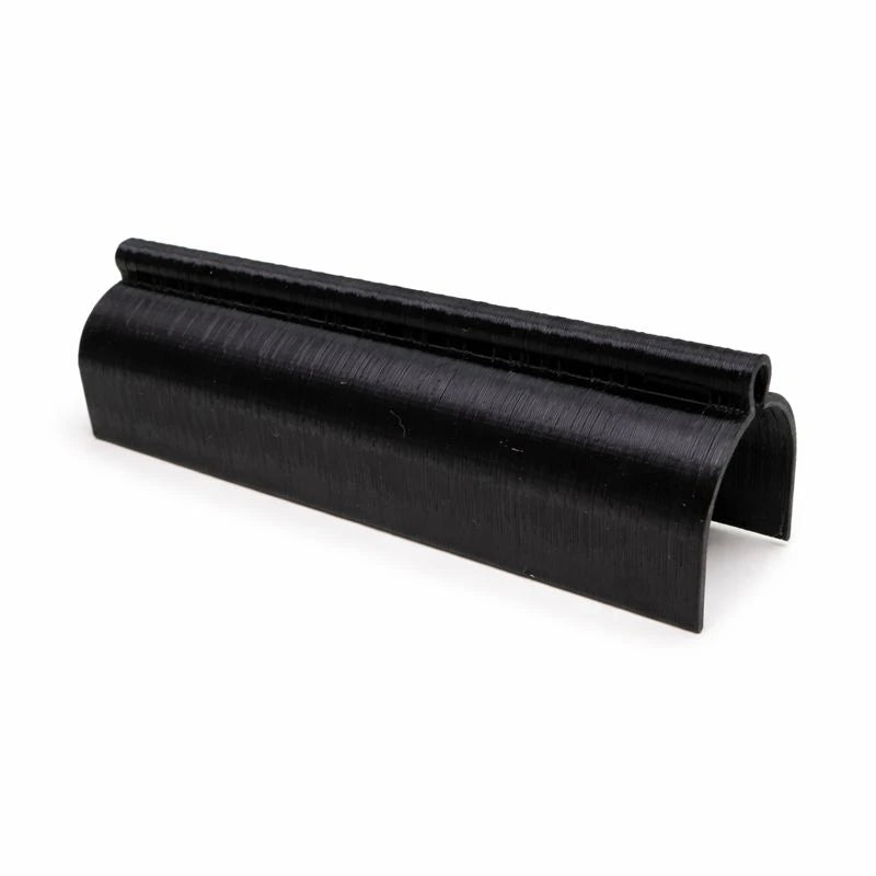 Black Test Tube Cover with a curved ridged top and open snap-fit sides, shown at an angle on a plain background