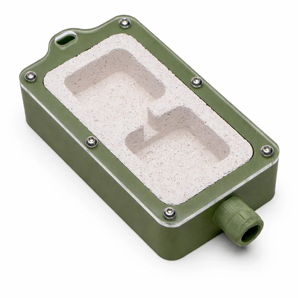 Green Small Ytong Nest - Type B at an angle, showing the two cubed chambers carved into the Ytong stone through the clear lid
