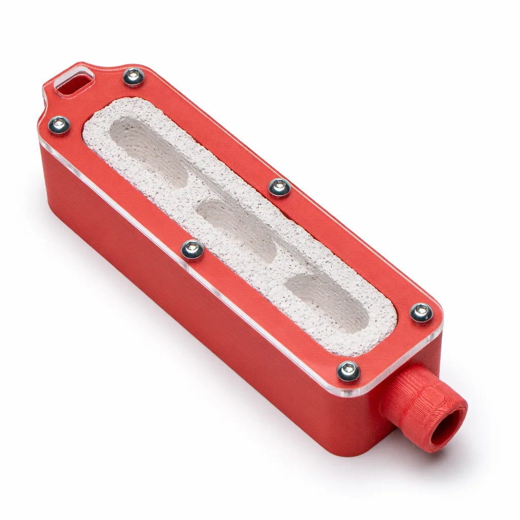 Founding Ytong Nest - Type A in red, showing the three connected chambers through the clear top window