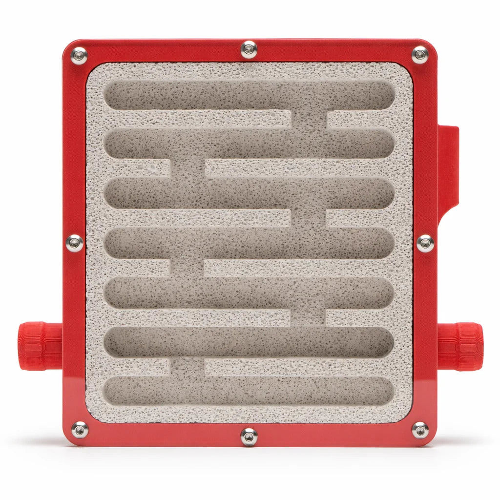 Red Medium Ytong Nest - Type A viewed head-on, showing the seven straight chambers carved into the Ytong stone with ports on both sides