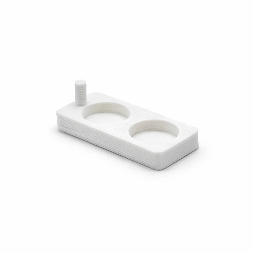 Single white Feeding Dish with two round wells and a locating post, from the Feeding Dish set of 20