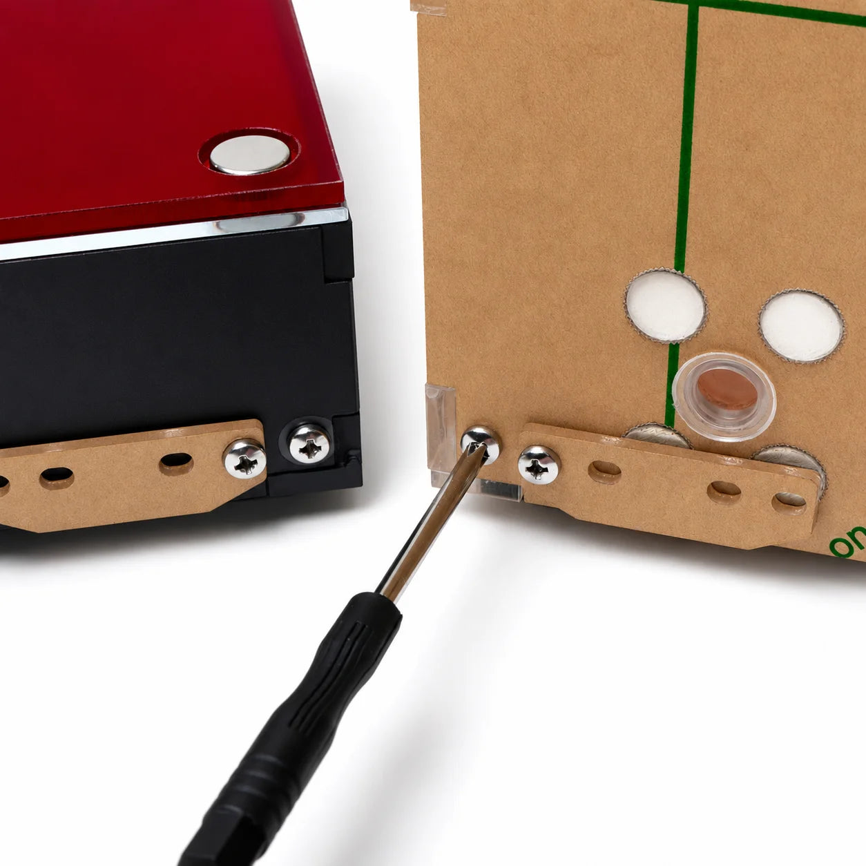 Screwdriver attaching the removable acrylic connection bar that joins the Red Gypsum Ant Nest to its outworld