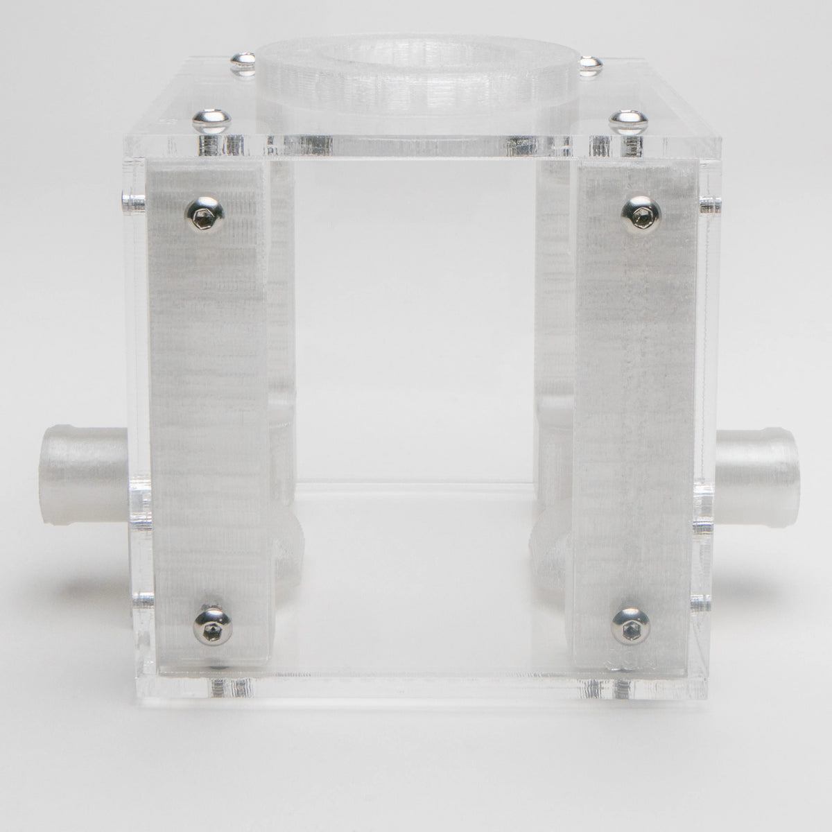 Small Outworld clear acrylic cube viewed from the front, with white connector ports on both sides and the feeding ring on top
