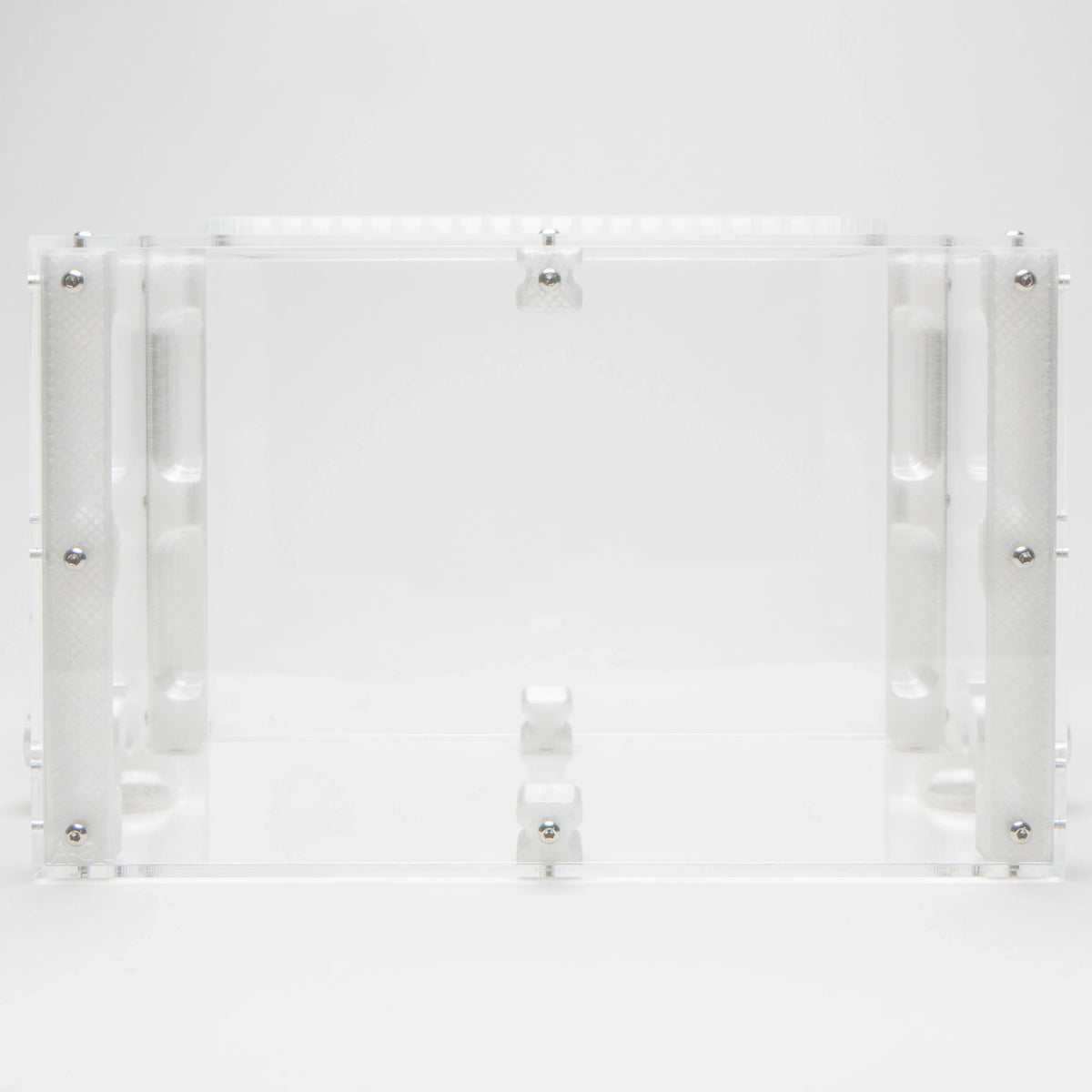 Large Outworld viewed straight-on, showing the empty acrylic enclosure with mesh vent strip on top and mounting posts inside